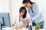 Two Business Woman Working In Office With Digital Tablet Stock Photo