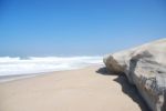 Small Cliff At A Beautiful Beach In Praia Del Rey Stock Photo