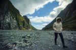 Traveling Woman Trekking In Franz Josef Glacier Most Popular Touring Destination In New Zealand Stock Photo