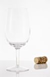 Empty Red Wine Glass And Wine Bottle Cork Stock Photo
