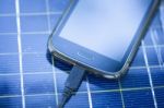 Mobile Phone On Solar Charger Stock Photo