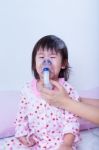 Doctor Helps Little Girl To Do Inhalation Stock Photo