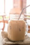 Iced Milk Coffee Glass On Wooden Table With Vintage Filter Effec Stock Photo