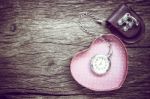 Pocket Watch And Gift In Heart Shape On The Background. Vintage Style Stock Photo