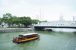 Blurred Abstract Background Of Boats Are Sailing On The River Underneath The Bridge Stock Photo