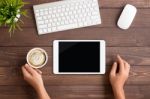 Hand Using White Tablet Blank Screen On Table Workspace Stock Photo