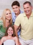 Portrait Of Happy Family Of Four Stock Photo