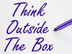 Think Outside The Box On Whiteboard Shows Innovation And Creativ Stock Photo