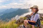 Hiker Girl With Happy On Phu Chi Fa Mountain Stock Photo