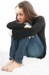 Sad Girl Teenager Hugging Her Knee Stock Photo