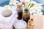 Spa And Wellness Treatment Setup On Wooden Panel Stock Photo