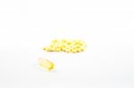 Fish Oil Capsule And Yellow Pills Isolated On White Background Stock Photo