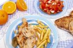 Turkey Steak With French Fries And Tomato Salad Stock Photo