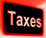 Taxes Sign Shows  Tax Or Taxation Stock Photo