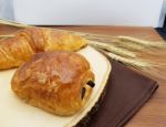 Plain And Chocolate Croissant On Wooden Board, Rustic Background Stock Photo