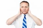 Businessman Covering His Ears With His Hands Stock Photo