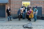 Group Of Men Busking On The Southbank Stock Photo