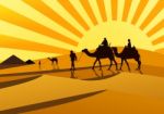 Silhouettes Of Camels At Sunset Stock Photo