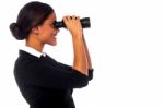 Corporate Woman Viewing Through Binoculars Stock Photo