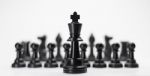Black King Chess With Others Isolate For Business Concept - Stra Stock Photo
