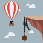 Businessman In Hot Air Balloon Fly Pass Businessman Hold On The Stock Photo