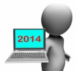 Two Thousand And Fourteen Character And Laptop Shows New Year 20 Stock Photo