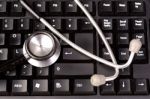 Stethoscope On A Computer Keyboard Stock Photo