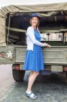 Dutch Woman Standing Against Military Jeep Stock Photo