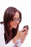 Girl Sending Text Sms At Cell Phone Stock Photo