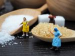Miniature Fat Woman Standing Near Wooden Bowl And Spoon With Sug Stock Photo