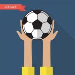 Referee Hand Holding A Soccer Ball Stock Photo