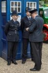 Policemen Outside An Old Fashioned English Blue Police Box Stock Photo