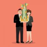 Businessman And Woman Holding A Lot Of Money Stock Photo
