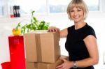 Blonde Woman Is Ready To Unpack Her Office Stuff Stock Photo