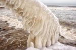 Ice Covered Staircase On The Beach Stock Photo