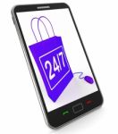 Twenty-four Seven Bag Represents Online Shopping Availability Stock Photo