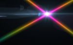 Abstract Cross Rainbow Digital Lens Flare With Black Background Stock Photo