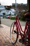 Retro Red Bike In City Stock Photo