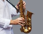 Hands Of A Musician With The Saxophone Stock Photo