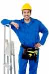 Young Handyman With Step-ladder Stock Photo