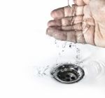 Water Flowing To Plughole Stock Photo
