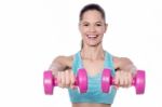 Active Young Woman Posing With Dumbbells Stock Photo
