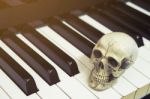 Piano Keyboard With Human Skull Stock Photo