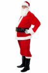 Confident Santa With A Big Belly Posing Sideways Stock Photo