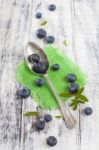 Vintage Spoon With Blueberries On White Wooden Table Stock Photo