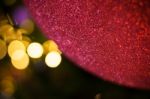 Close Up Big Red Glitter Ball Christmas On Tree With Wire White Light Background Stock Photo