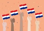 Hands Holding Up Netherlands Flags Stock Photo