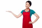 Female Chef Promoting Bakery Product Stock Photo