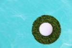 Golf Ball On Center Island Grass Field And Water Stock Photo