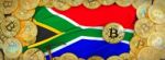 Bitcoins Gold Around South Africa  Flag And Pickaxe On The Left Stock Photo